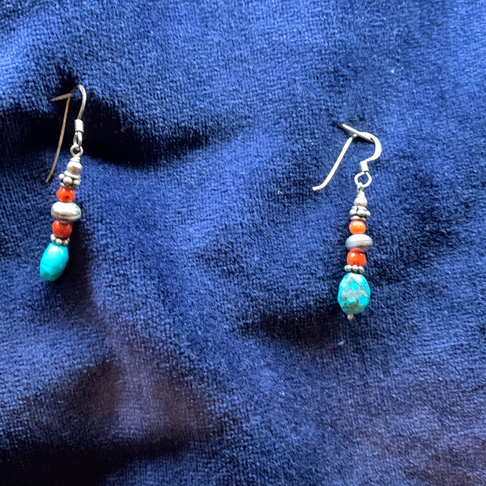 Silver, turquoise, and red bead drop earrings.